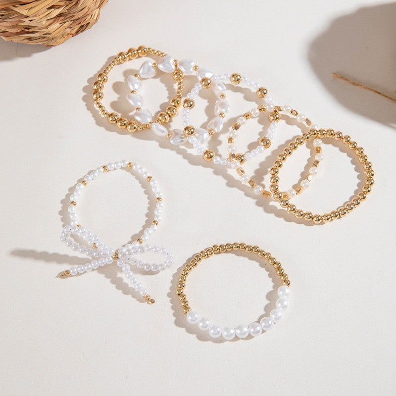 Multi-Layer Pearl & Gold Bead Bracelet with Bow Charm