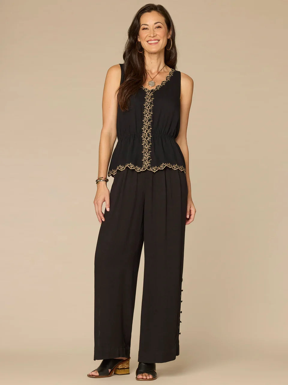Embroidered Scallop Peplum Top in Black